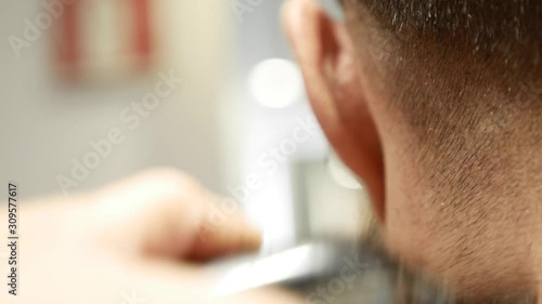 middle aged man having his hair cut at the hairdresser or barber shop, hipster style, beauty concept photo