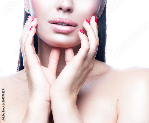 Lips  beauty part of face   beautiful young woman touching healthy skin. Skincare facial treatment concept