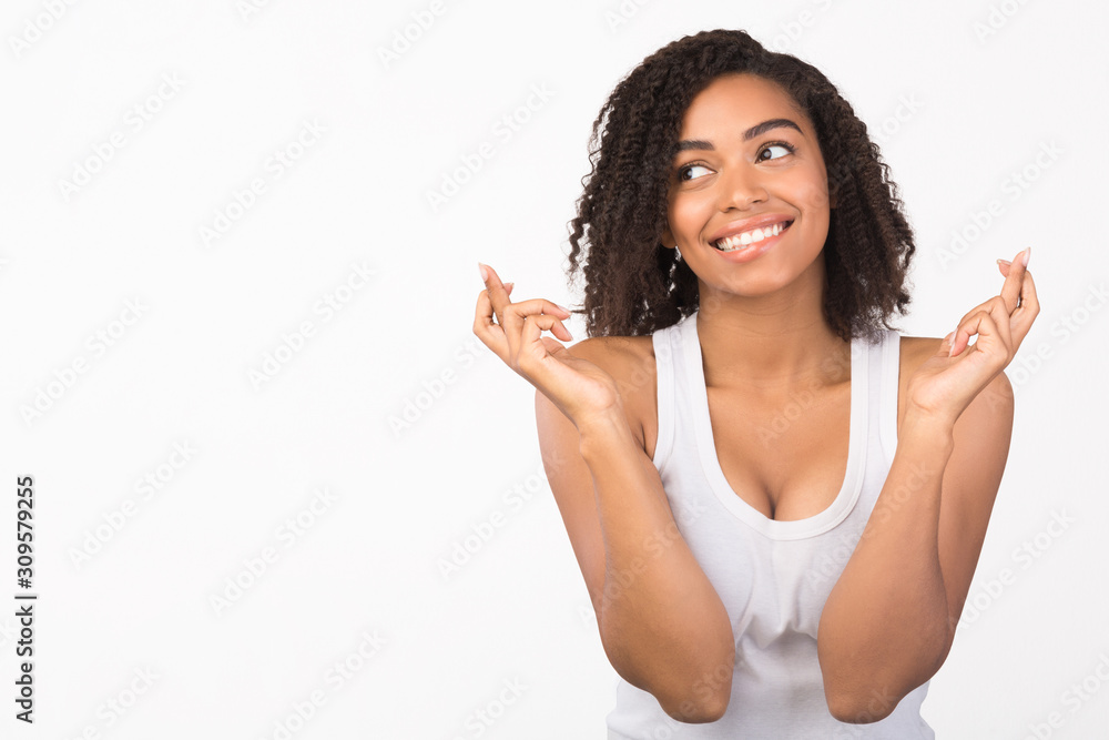 Curly afro girl keeping her fingers crossed Curly afro girl keeping her fingers crossed