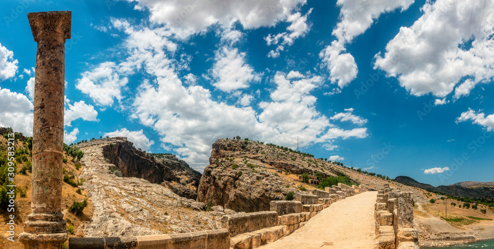 Panoramic view of the Severan Bridge, Cendere Koprusu is a late Roman bridge, close to Nemrut Dagi and Adiyaman, Turkey. Roadway flanked by ancient columns of Roman Emperor Lucius Septimius Severus Panoramic view of the Severan Bridge, Cendere Koprusu is a late Roman bridge, close to Nemrut Dagi and Adiyaman, Turkey. Roadway flanked by ancient columns of Roman Emperor Lucius Septimius Severus