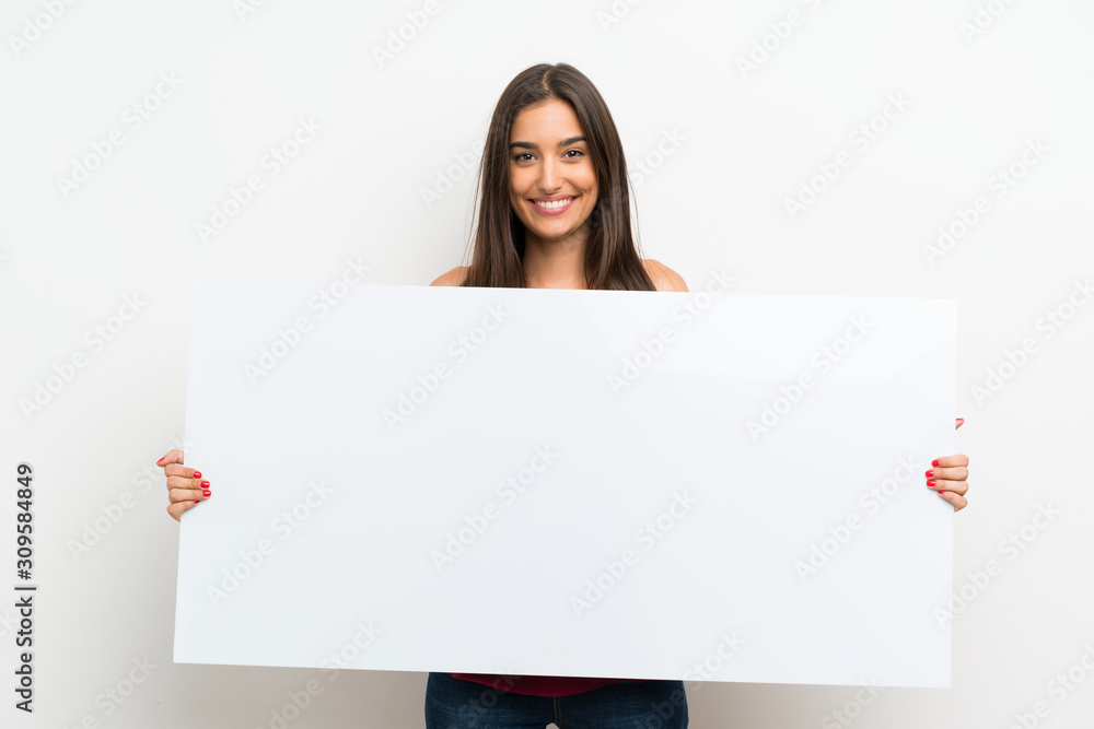 Young woman over isolated white background holding an empty white placard for insert a concept Young woman over isolated white background holding an empty white placard for insert a concept