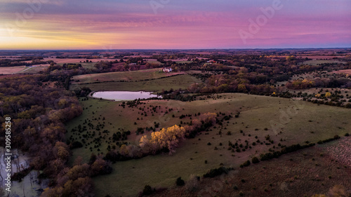 Sunrise over a rural countryside pond in Nebraska during autumn
