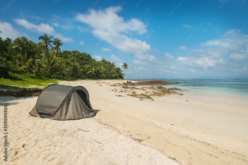 Tourist tent camping on sand beach