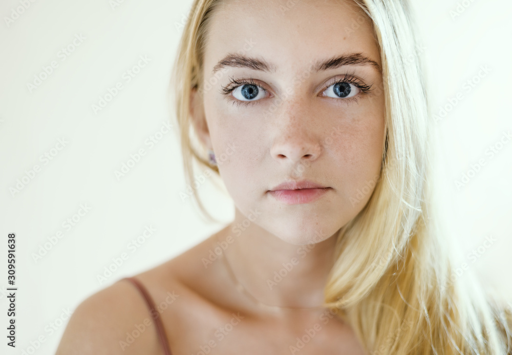 Portrait of beautiful sensual woman with blue eyes. Studio shot. Portrait of beautiful sensual woman with blue eyes. Studio shot.