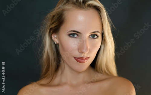 Portrait of beautiful sensual woman with green eyes. Studio shot.