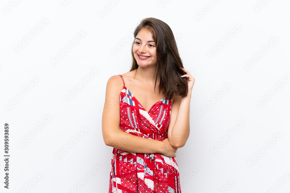 Caucasian girl in red dress over isolated white wall thinking an idea Caucasian girl in red dress over isolated white wall thinking an idea