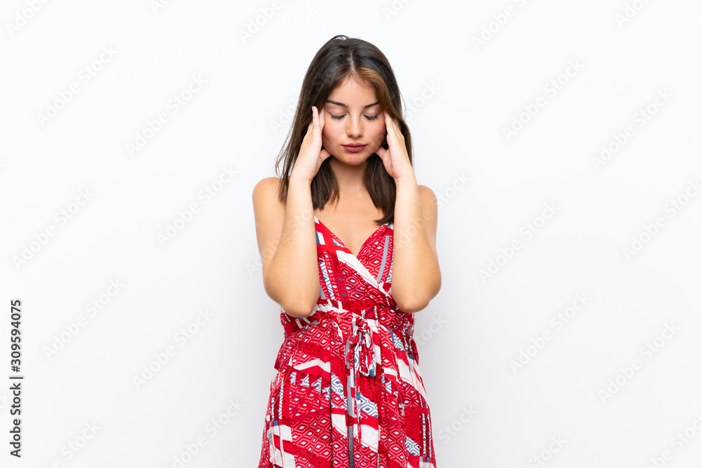 Caucasian girl in red dress over isolated white wall with headache Caucasian girl in red dress over isolated white wall with headache