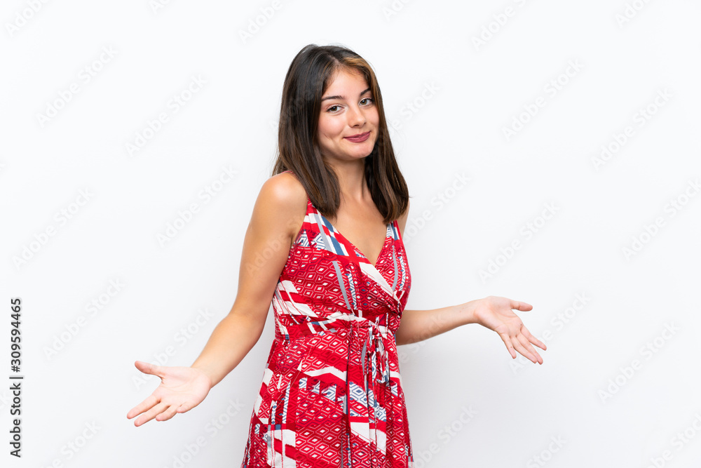 Caucasian girl in red dress over isolated white wall smiling Caucasian girl in red dress over isolated white wall smiling