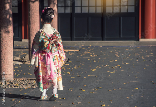  Girls wear kimonos as the national dress of Japan  walk in temples to go to festivities.