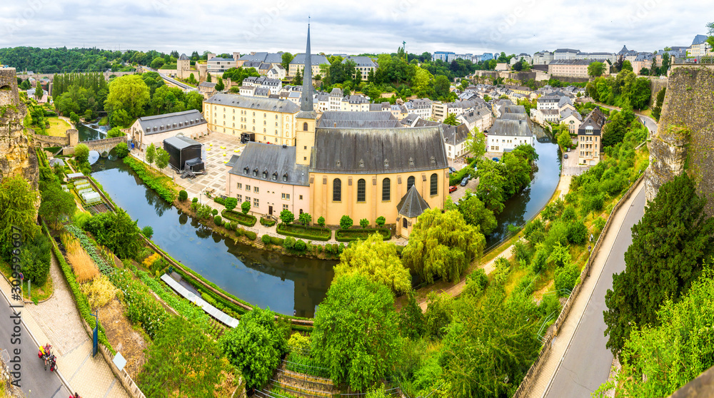 Naklejka premium Luxembourg cityscape, church on river, panorama