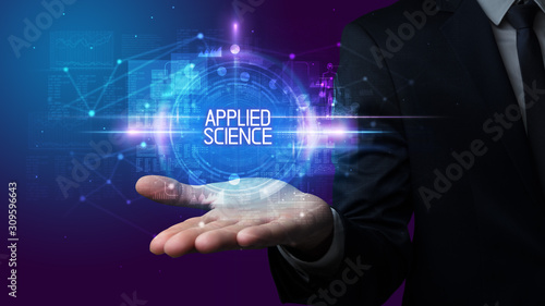 Man hand holding APPLIED SCIENCE inscription, technology concept