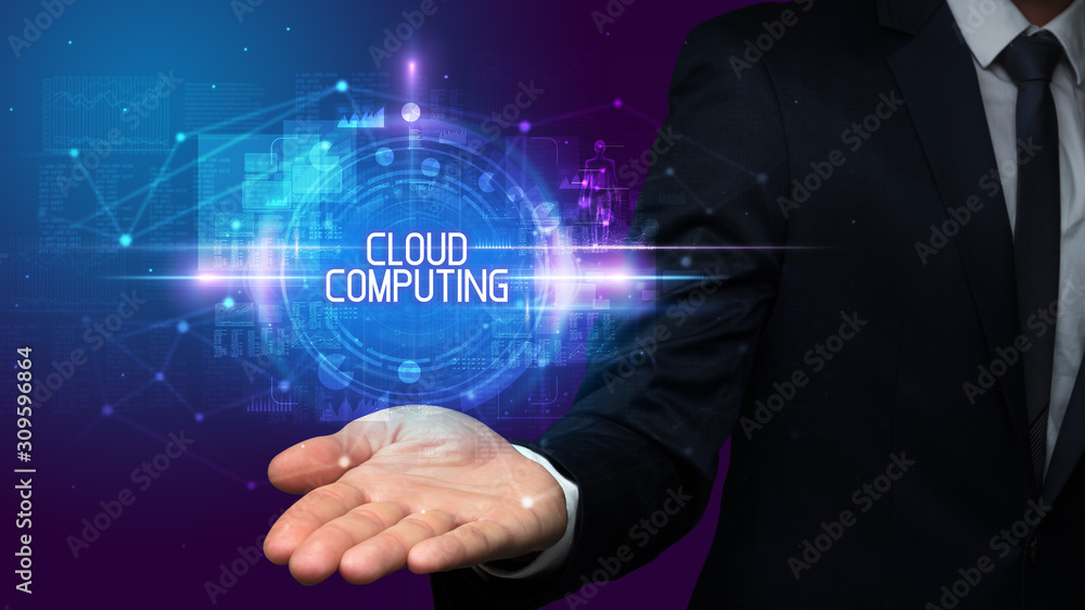 Man hand holding CLOUD COMPUTING inscription, technology concept Man hand holding CLOUD COMPUTING inscription, technology concept