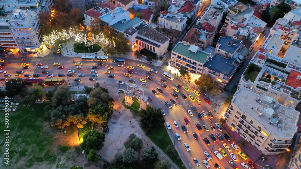 Aerial drone night photo of illuminated popular tourist area in Athens metropolitan centre at dusk with beautiful colours, Attica, Greece