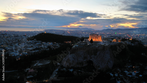 Aerial drone night shot of iconic Acropolis hill and the Parthenon at dusk with beautiful sky colours, Athens, Attica, Greece