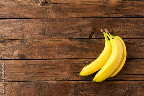 Bananas on wooden background. Fruit background
