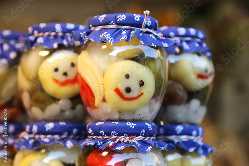 Homemade canned pickles in a jars at christmastime as a gift © acceptfoto