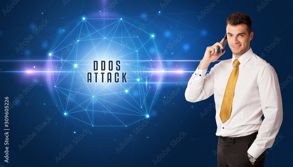 Businessman thinking about security solutions with DDOS ATTACK inscription Businessman thinking about security solutions with DDOS ATTACK inscription