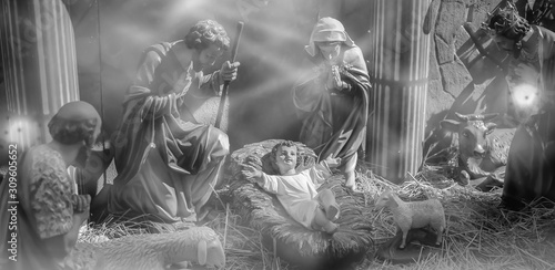 Traditional Christmas scenes and sacred light shining for use in illustration design Nativity scenes with Jesus baby on the manger with carvings, including Jesus, Mary, Joseph, sheep and magi photo