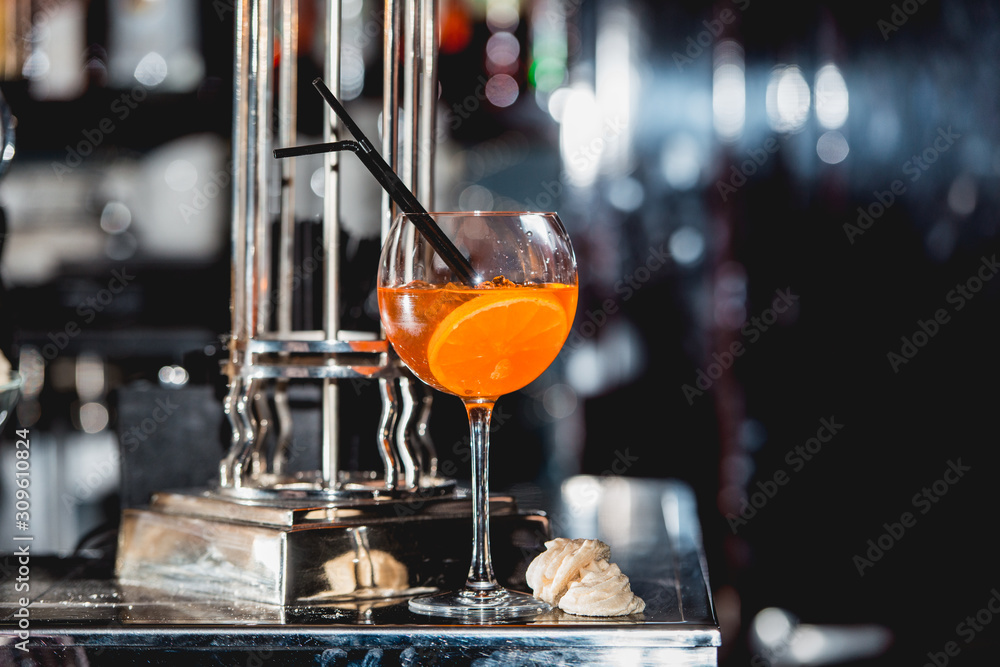 glass of refreshing orange alcoholic cocktail on a table in the bar glass of refreshing orange alcoholic cocktail on a table in the bar