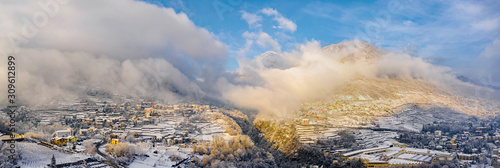 Valtellina (IT) - Sondrio - Panoramic view of Mossini and Ponchiera village with whitewashed landscape