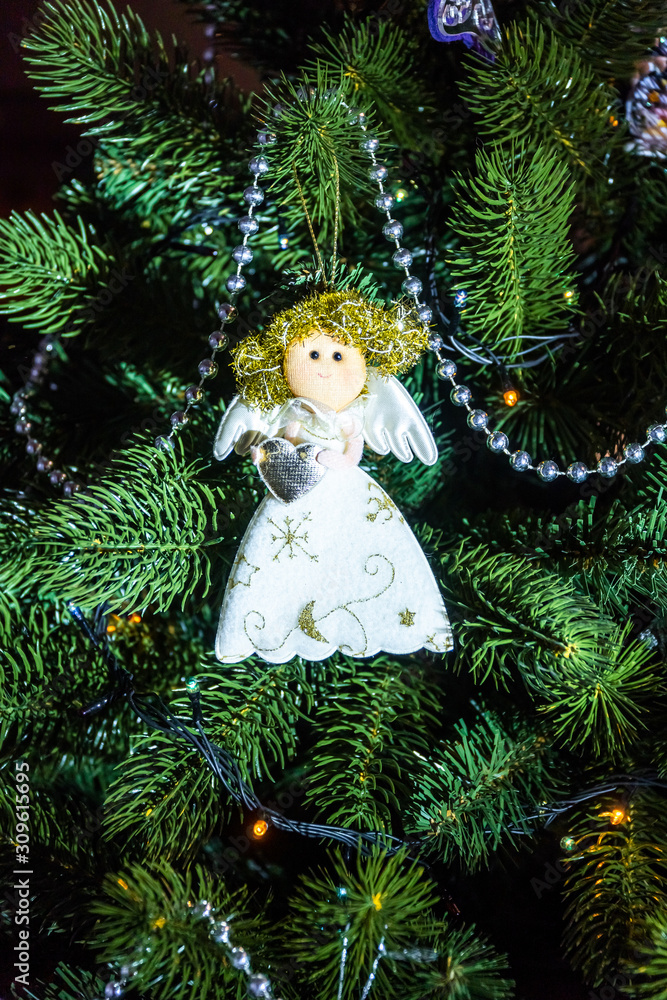 Christmas holiday decorations and toys on home Christmas tree. Christmas holiday decorations and toys on home Christmas tree.
