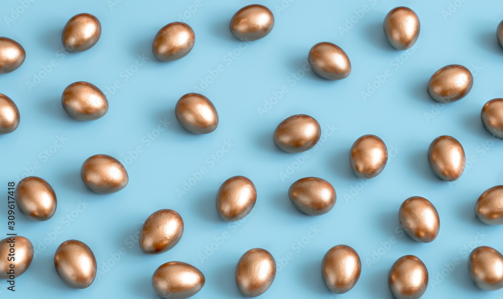 Background with Easter eggs in gold color.