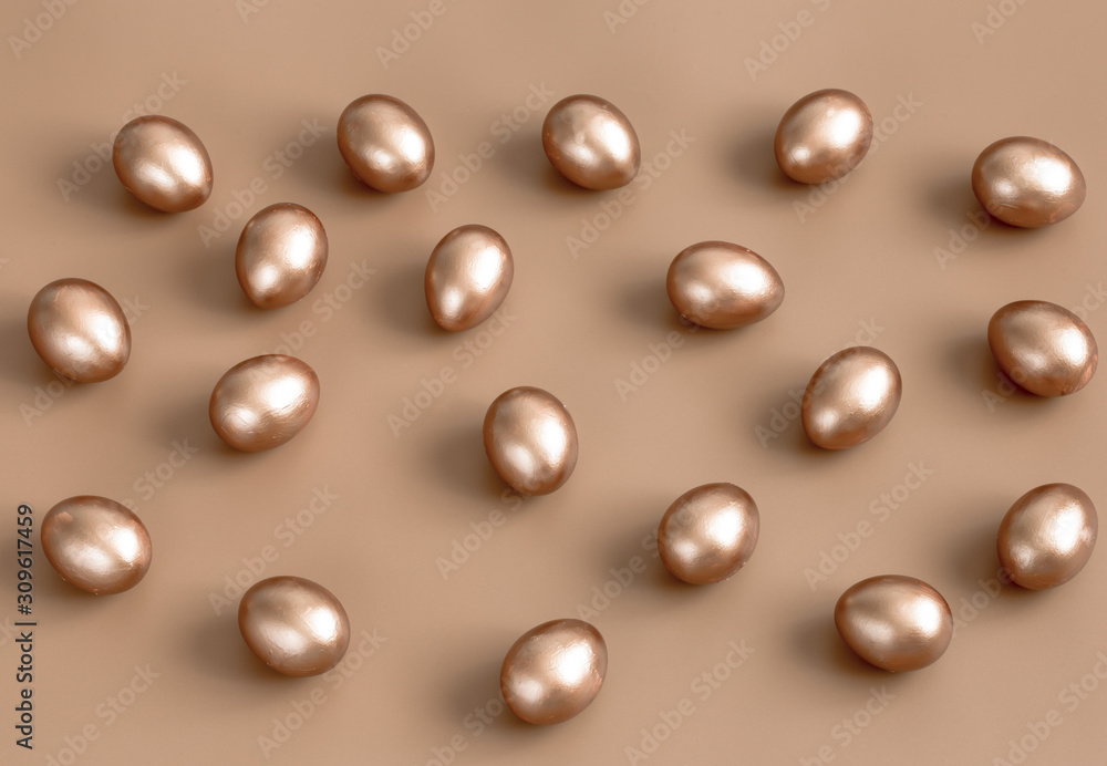 Background with Easter eggs in gold color. Background with Easter eggs in gold color.