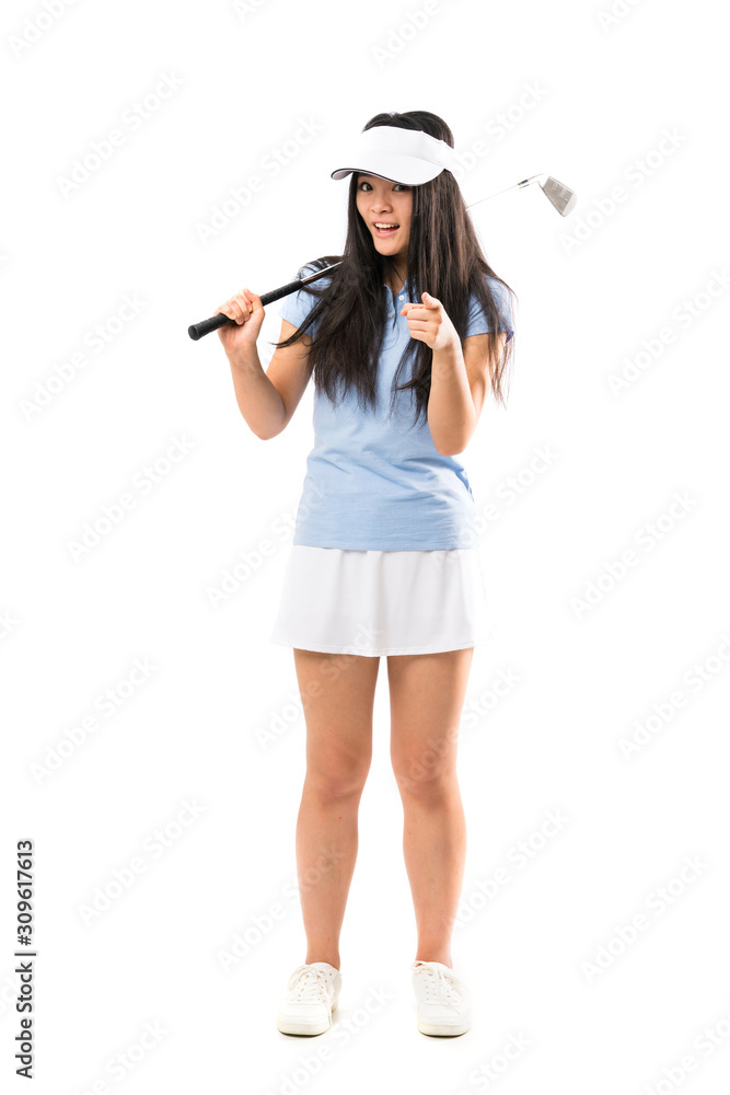 Young asian golfer girl over isolated white background surprised and pointing front Young asian golfer girl over isolated white background surprised and pointing front