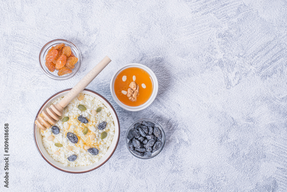 Сurd on a plate with raisin, honey, pumpkin seed. Healthy breakfast Cottage cheese Сurd on a plate with raisin, honey, pumpkin seed. Healthy breakfast Cottage cheese