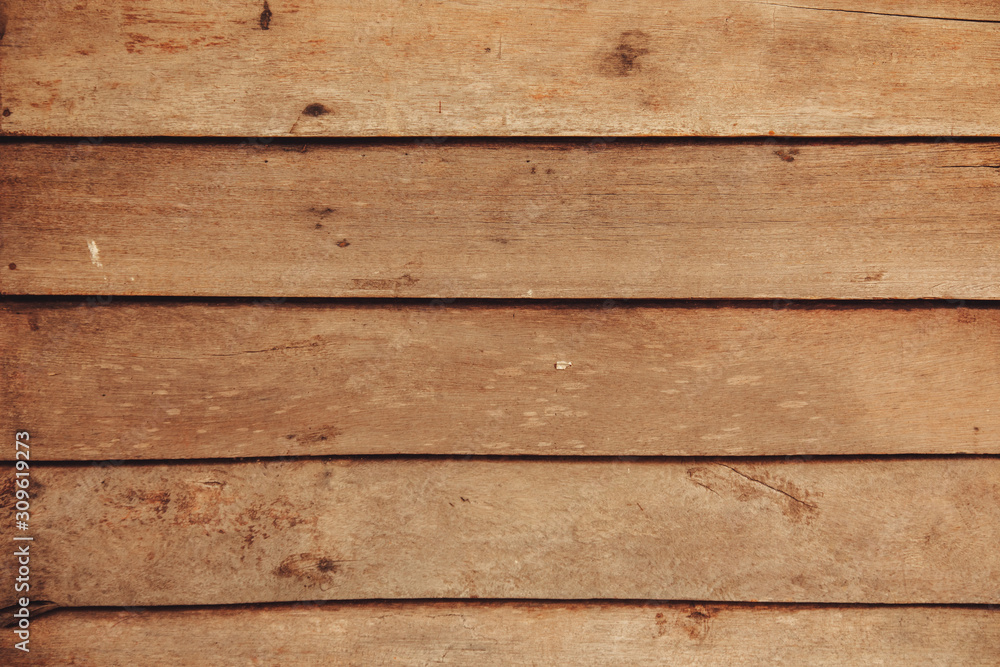 Naklejka premium The background of the old wooden planks used to make the walls reminds us of olden days when most houses were still built with wood.