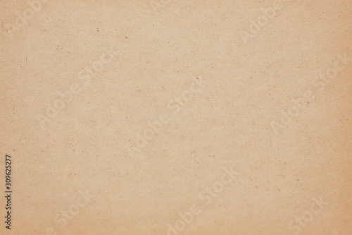 Rough surface of the paper sheet. Old and yellowed. Spots, fibers and blotches, beige or light brown. Top view. Reduced contrast. Macro