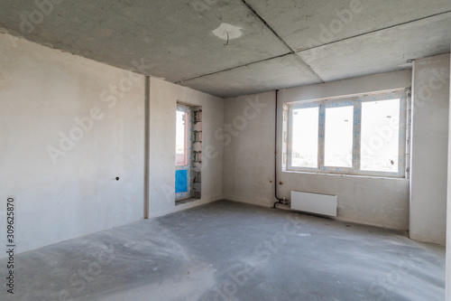 Russia, Omsk- August 05, 2019: interior room apartment. rough repair for self-finishing. interior decoration, bare walls of the room, stage of construction