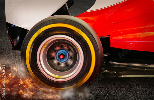 Formula 1 Rear wheel spinning and drifting after launch on a dark asphalt with smoke and dirt flying around © Atmosphere