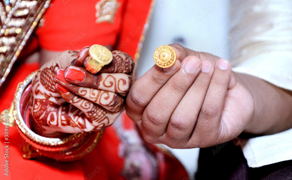 An Indian bride and groom their Shows Engagement Rings during a Hindu