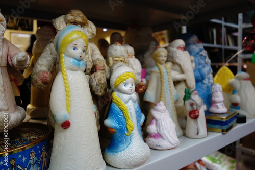 Vintage Russian Father Christmas and Snow Maiden figurines in a row photo