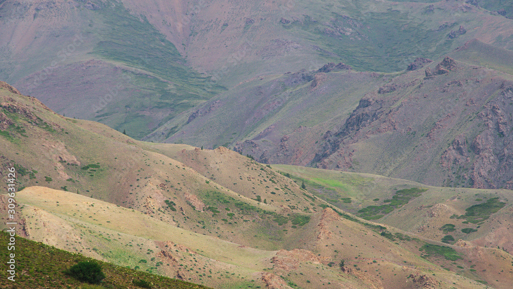 gentle red hills, journey through mountain valley, pastures for animals, soil erosion in arid steppe