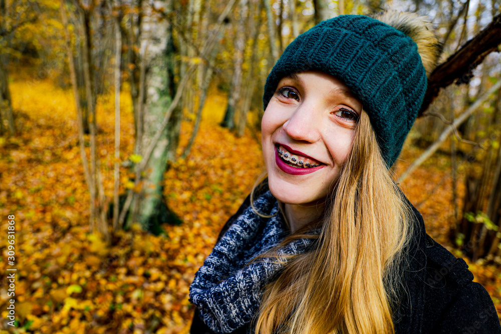 portrait of young woman in autumn park portrait of young woman in autumn park