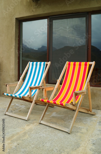 Vertical image of two deckchairs at the outdoor terrace