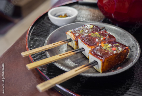 Tofu with sauce and sprinkled with colorful sugar is Japanese street foods