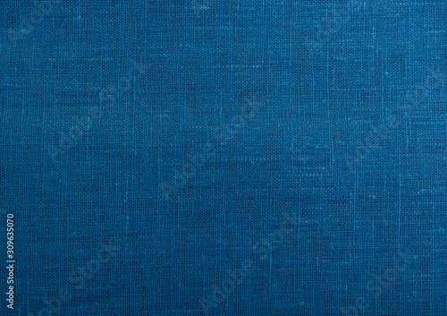Classic blue fabric blank canvas, cotton or linen texture, 2020 fabric trendy color swatch for clothes, interior.