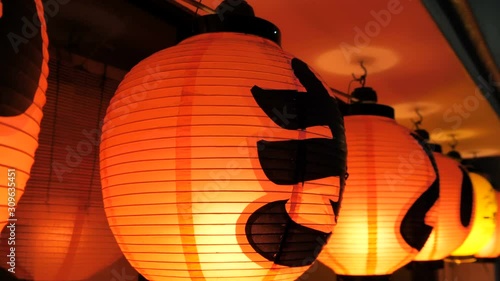 The orange lanterns hanging outside the restaurant in Tokyo Japan
