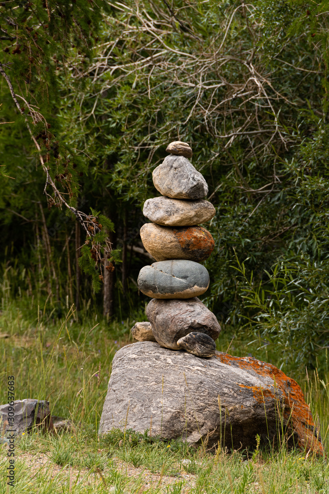 Slide of stones for orientation in forest. Hiking in mountains. Meditation, state of balance of soul. Yoga classes in nature Slide of stones for orientation in forest. Hiking in mountains. Meditation, state of balance of soul. Yoga classes in nature