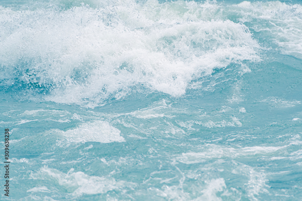 Fototapeta premium Blue ocean waves, tide. Swift current of river