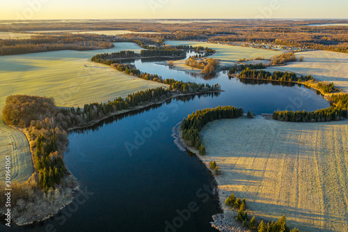 Aerial: a panorama view above the curvy lake