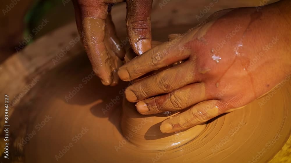 Potter at work makes ceramic dishes. India, Rajasthan. Potter at work makes ceramic dishes. India, Rajasthan.