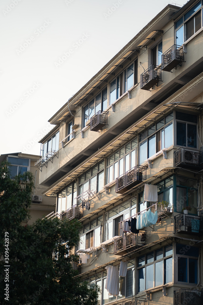 Asian Apartment building with laundry drying