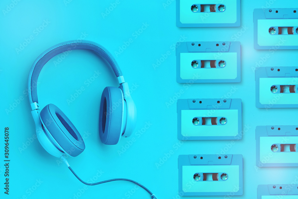 Turquoise headphones a colored background. Music concept with copyspace. Blue headphones isolated Turquoise headphones a colored background. Music concept with copyspace. Blue headphones isolated