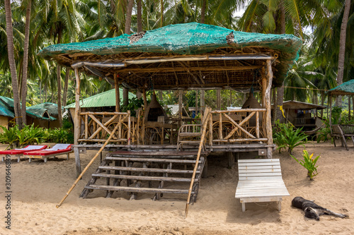 Shelter from the sun with sun loungers on the beach of El Nido Palawan Philippines photo