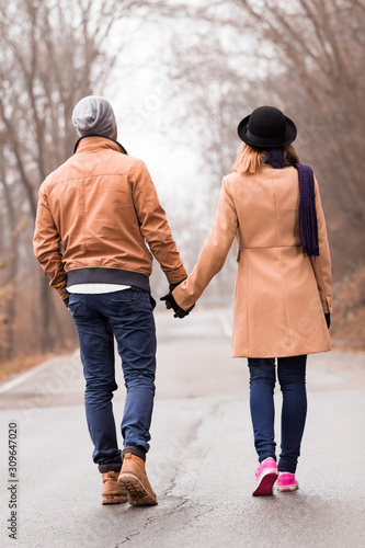 Couple enjoying outdoors in cold autumn / winter time.