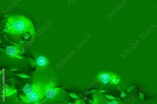 holiday decorations. colorful Christmas lights.green luxury background.space for text